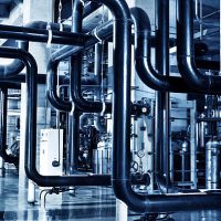 Modern boiler room equipment for heating system. Pipelines, water pump, valves, manometers.