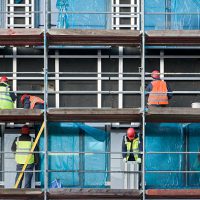 Construction workers on scaffolding