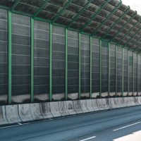 Noise barrier wall on road