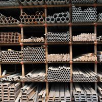 Different sizes of metal pipes on shelf