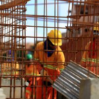 salvador, bahia, barazil - march 23, 2017: Worker handles iron construction work in the city of Salvador.
