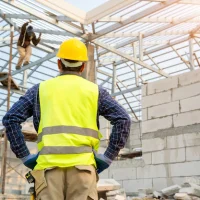 engineer-technician-looking-up-analyzing-unfinished-construction-project_64073-111