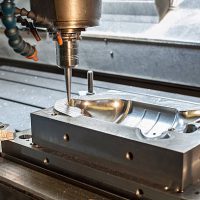 Industrial metal mold/blank milling. Metalworking. Lathe and drilling industry. CNC technology.