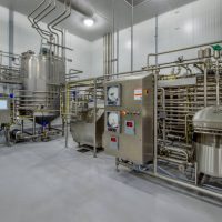 Steel tanks and pipes for milk processing and pasteurization.
